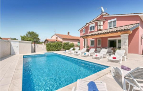 Nice home in Stinjan with Outdoor swimming pool, WiFi and 5 Bedrooms